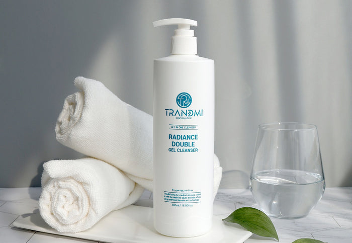 A bottle of Trandmi Radiance Double Gel Cleanser with a pump dispenser, primarily white in color with brand and product name displayed.